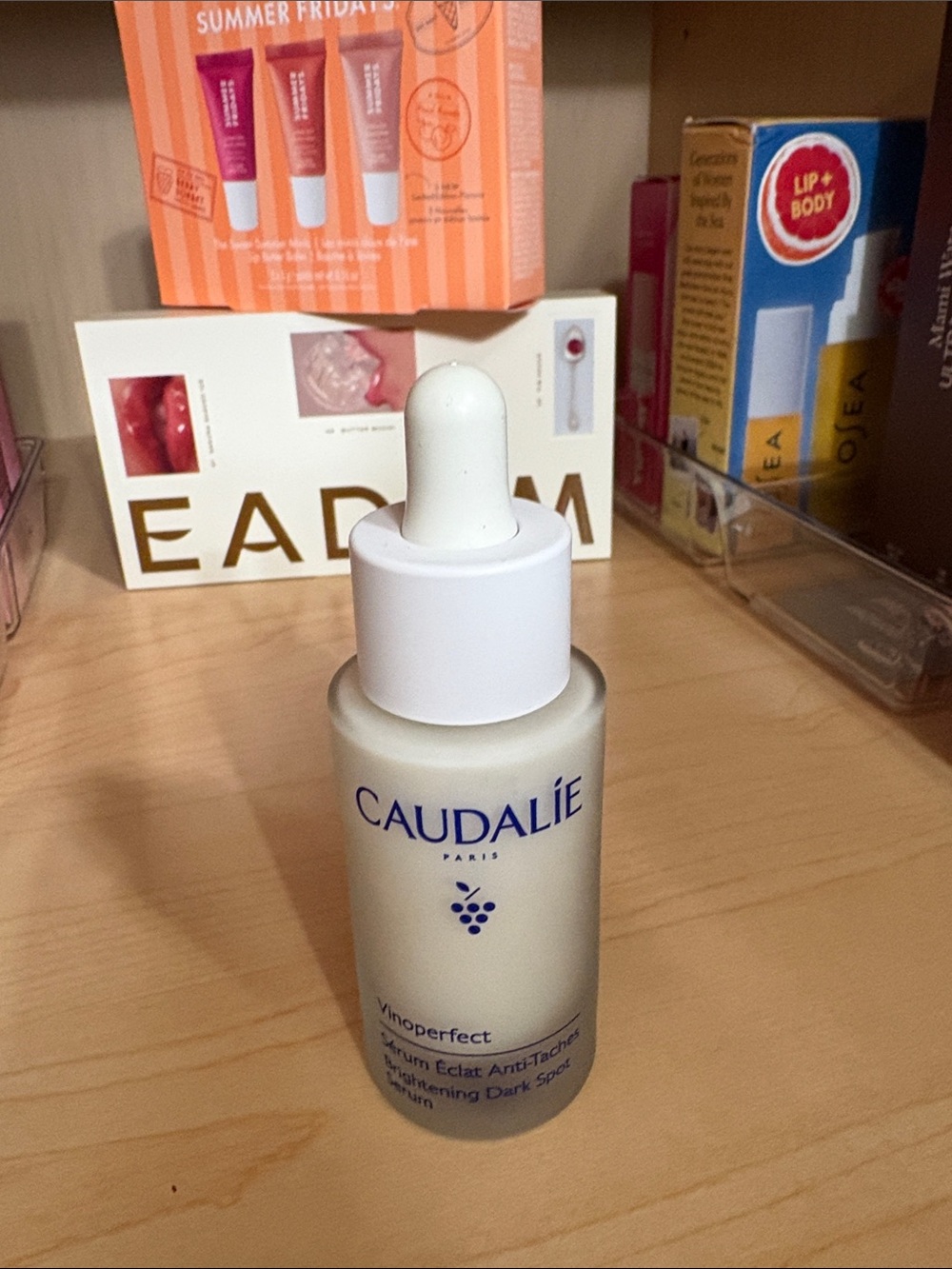 Caudalie Vinoperfect Serum in Frosted White Bottle with Blue Logo